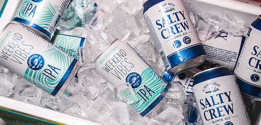 Coronado Brewing Weekend Vibes IPA and Salty Crew Blonde Ale chilling in a cooler packed with ice—ready for quick cooling