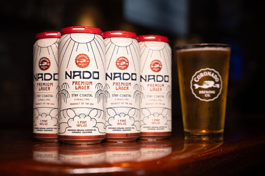 Coronado Brewing Nado Premium Lager cans and pint glass